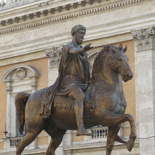 A bronze statue of the Stoic Emperor Marcus Aurelius on a horse in Rome, Italy. 
